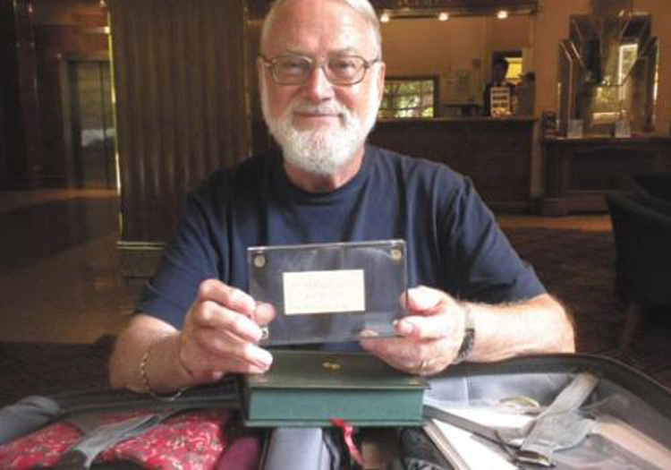 Dan Calinescu, the card, and a suitcase full of ‘goodies’ (Credit: The Independent London Newspaper)